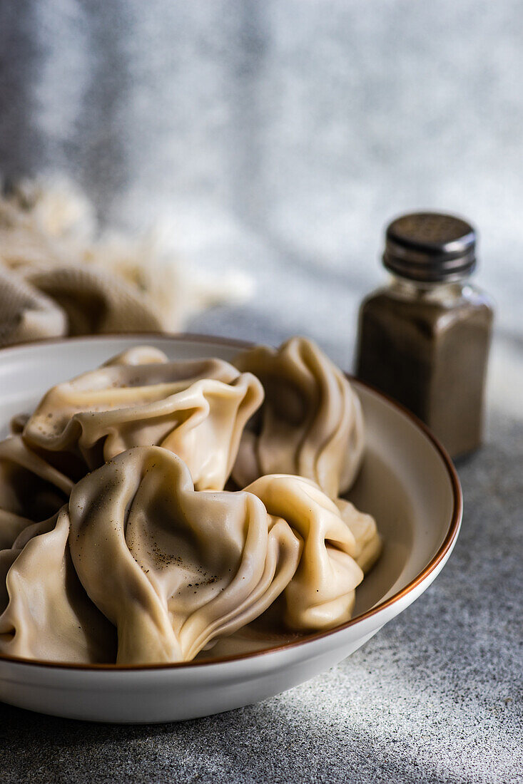 Fresh boiled traditional Georgian khinkali in the bowl