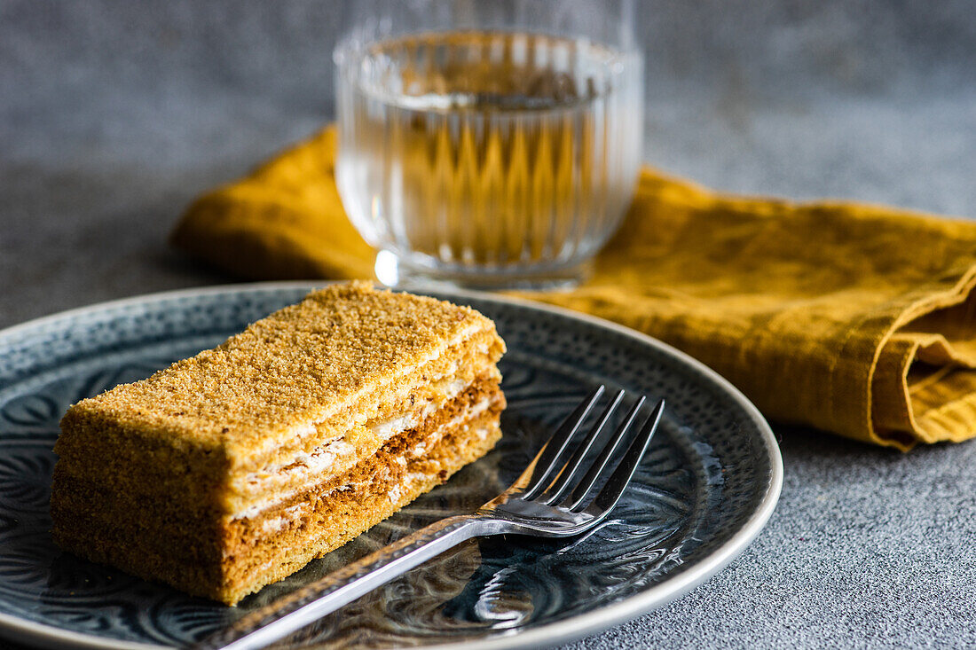 Gourmet slice of honey cake served on ceramic plate