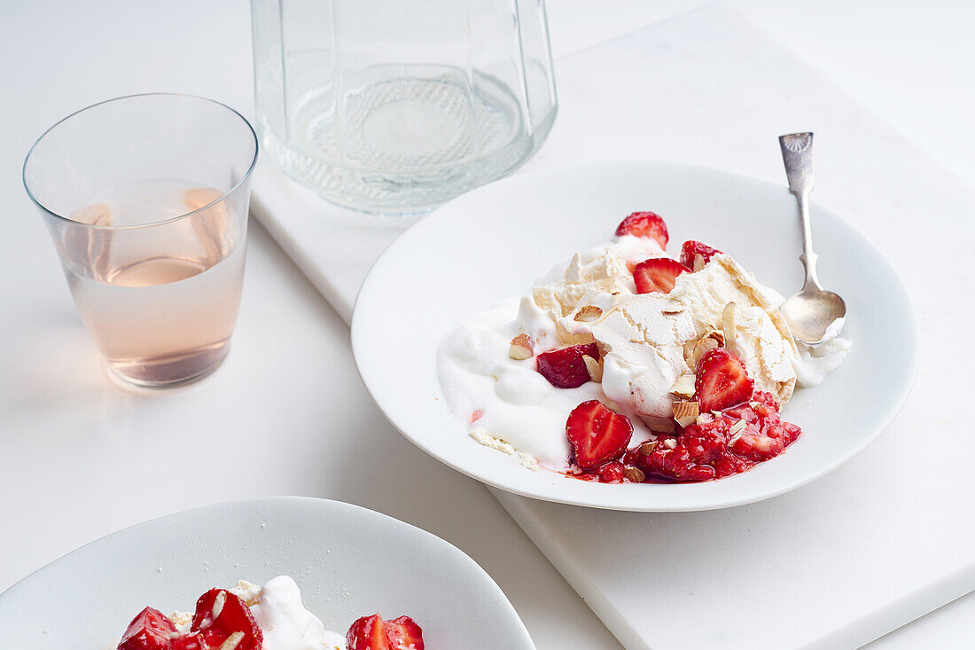 Dessert with berries, meringue and whipped cream. Eton's mess with strawberries, sweet treat with summer mood