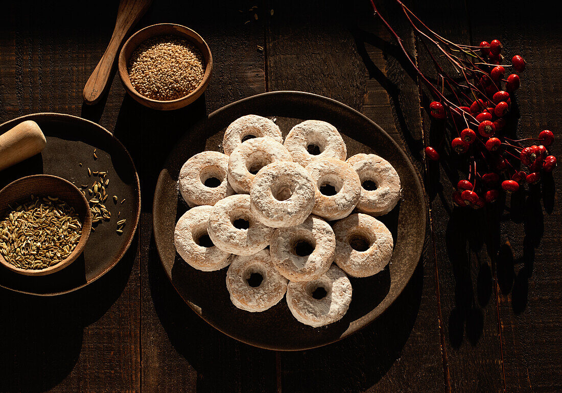 Top view of Christmas Wine Donuts on a wooden table surrounded by ingredients