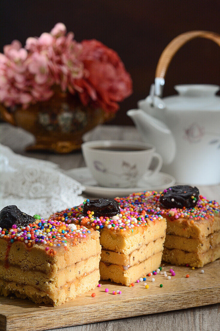 Delicious traditional Turron de Dona Pepa dessert with colorful dragee served on plate on table