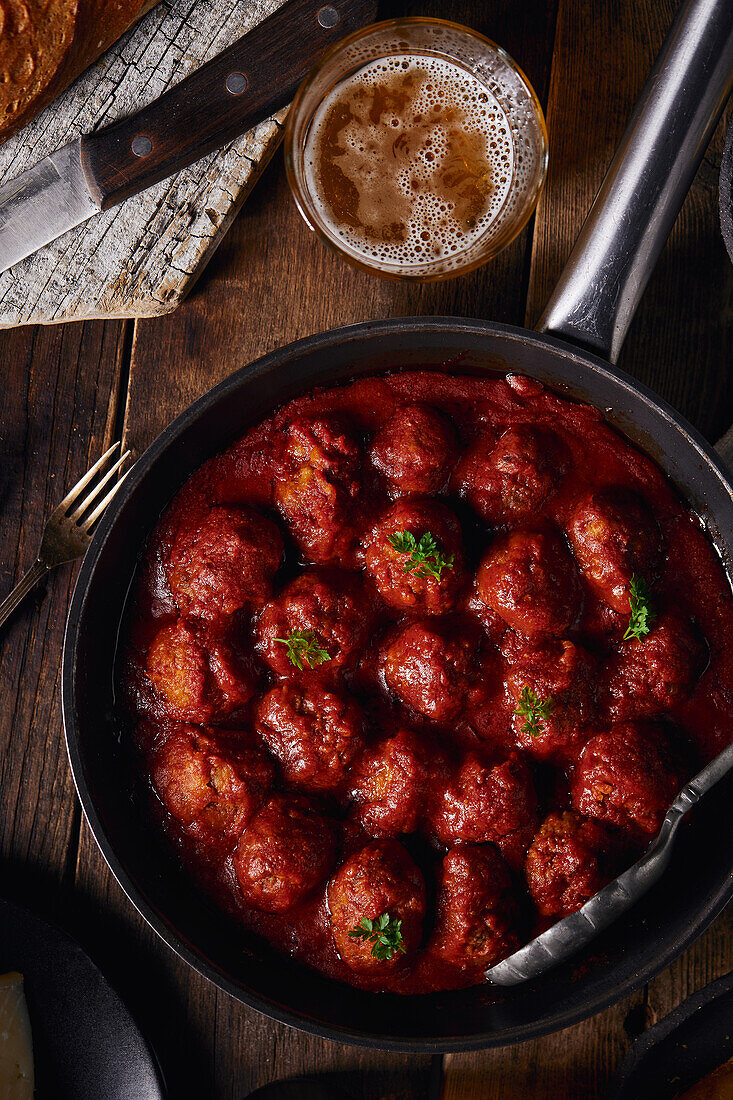 Closeup viewed from above of a plate of meatloaf with tomato