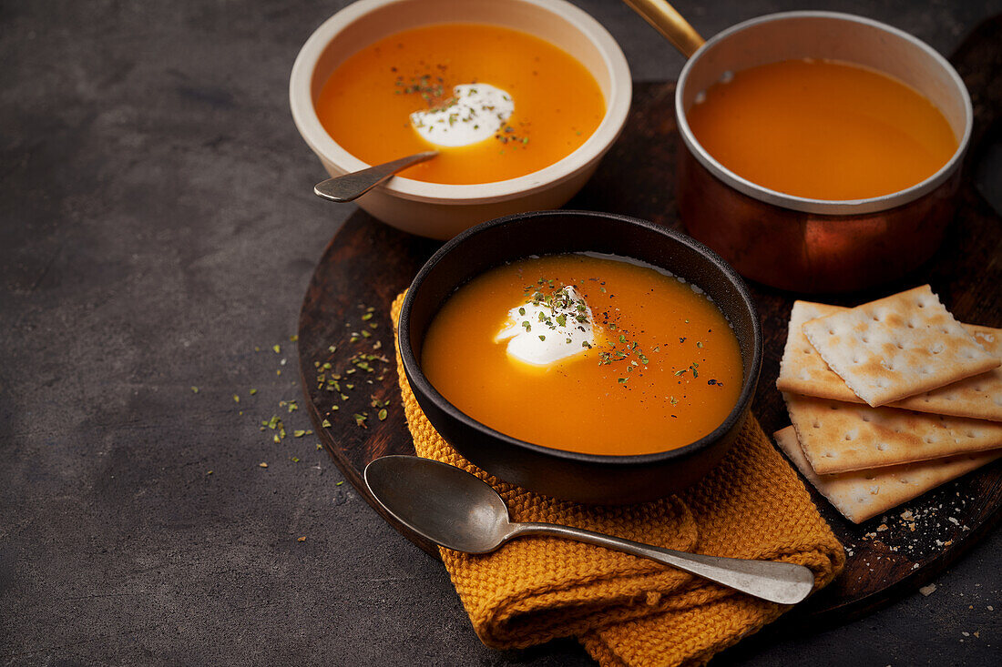 Delicious plates of creamy pumpkin soup seen from above