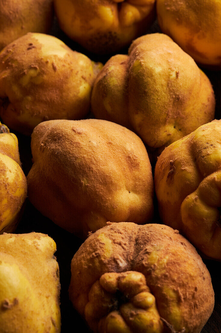 Top view of fresh whole sour yellow lemons on wooden background