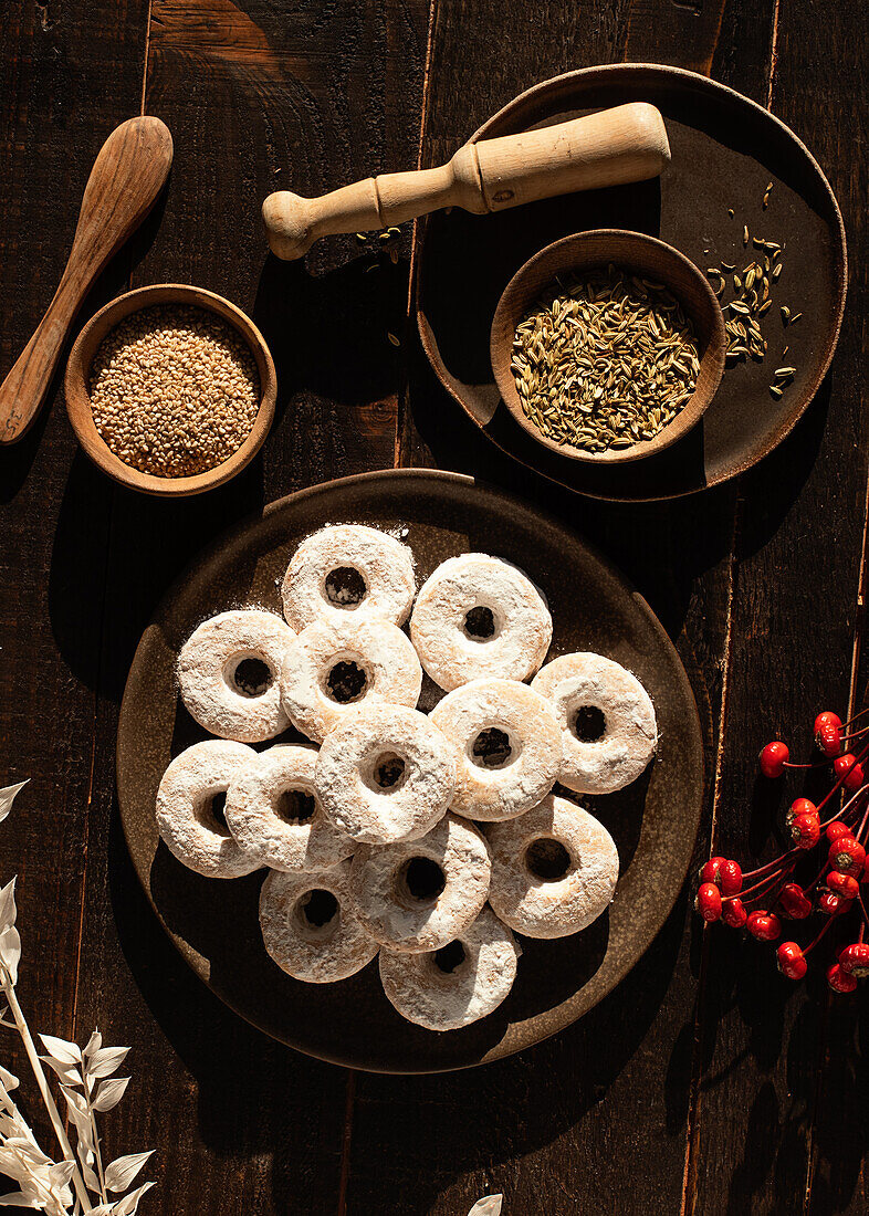 Top view of Christmas Wine Donuts on a wooden table surrounded by ingredients