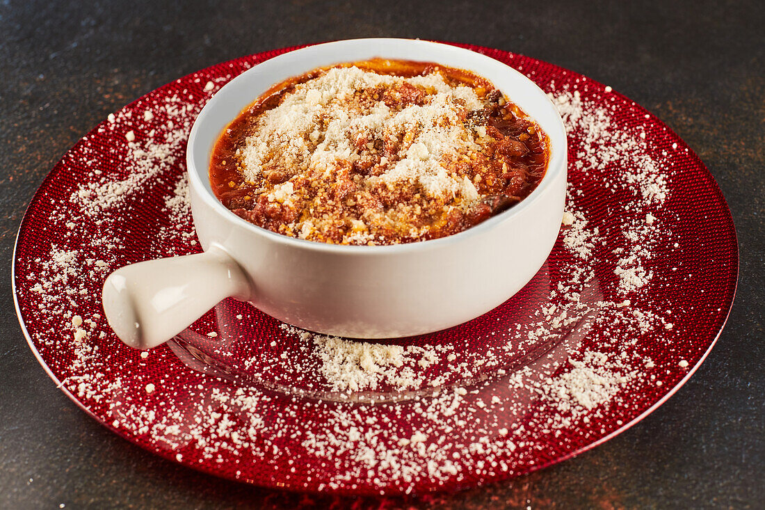 Delicious eggplant parmesan dish served in ceramic pot during dinner in restaurant