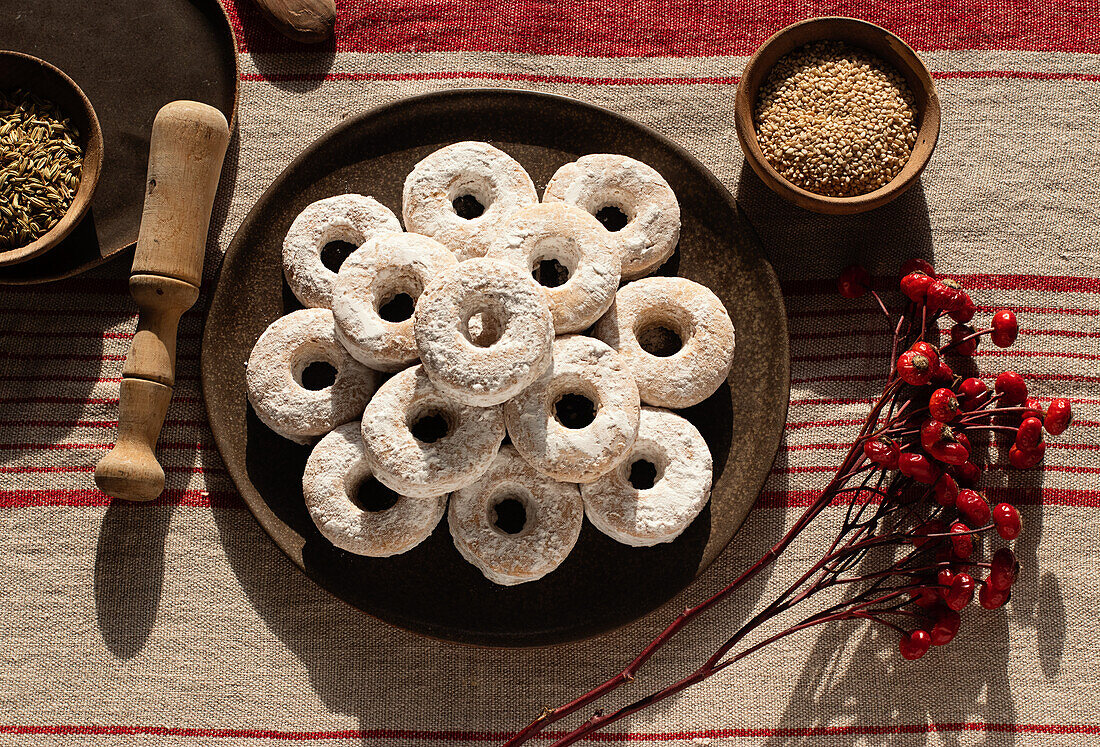 Top view of Christmas Wine Donuts on a wooden table surrounded by ingredients