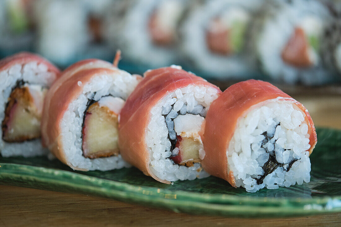 Stock photo of yummy sushi plates in japanese restaurant.