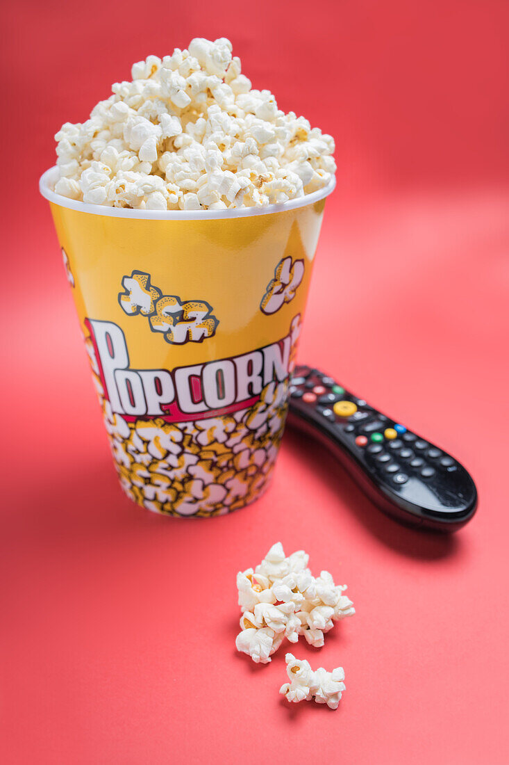 Closeup of some popcorn on a red background