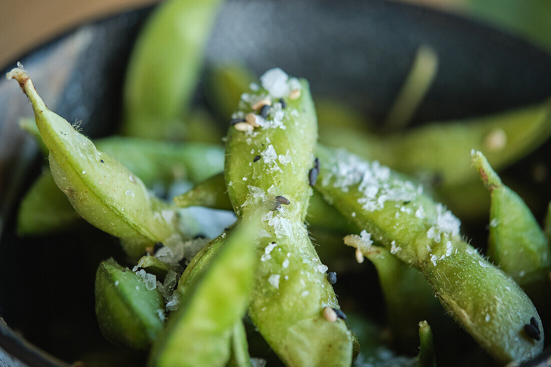 Stock photo of delicious salted edamame beans in japanese restaurant.