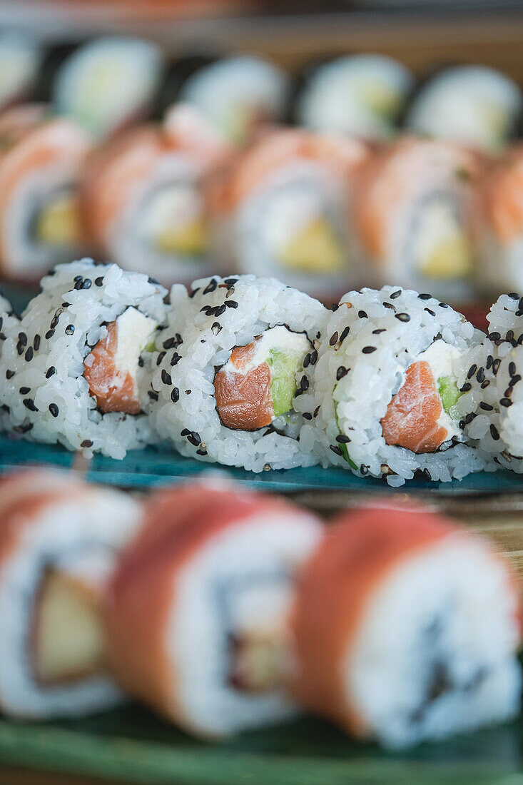 Stock photo of yummy sushi plates in japanese restaurant.