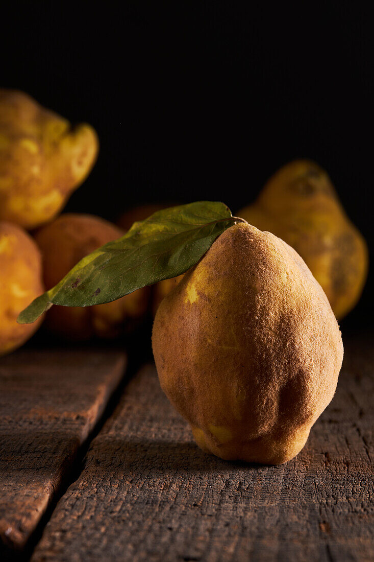 Fresh whole sour yellow lemons on wooden background