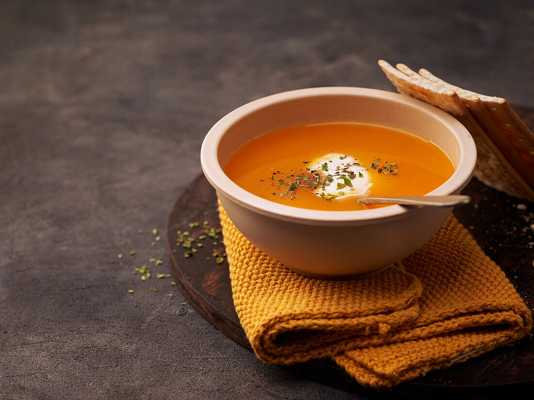 Delicious plates of creamy pumpkin soup seen from above