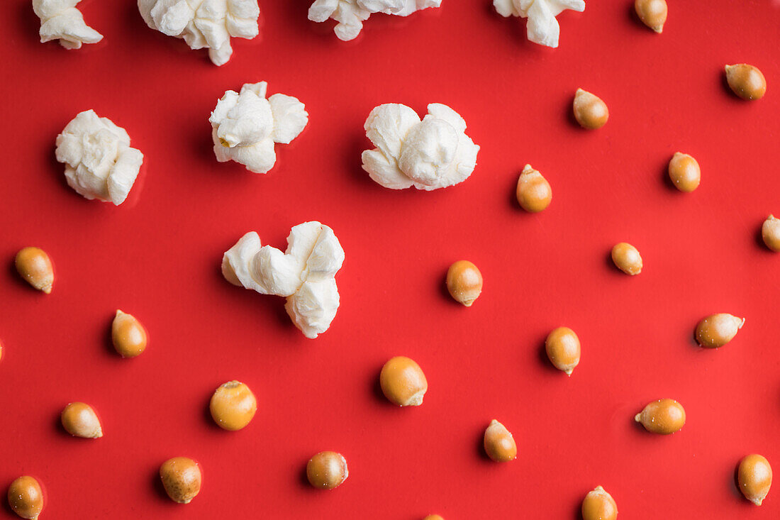 Closeup of some popcorn on a red background