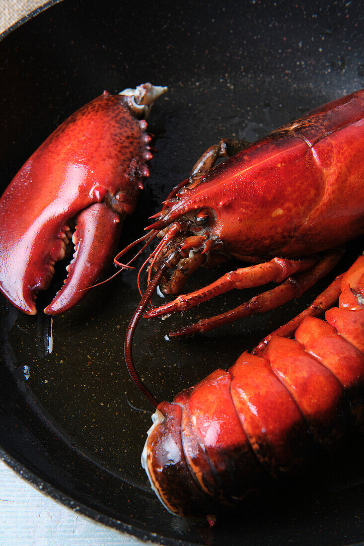 Raw lobster in sauce pan prepared for being grilled