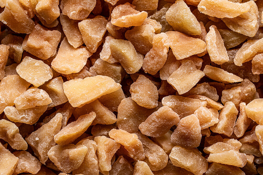 Top view full frame of heap of delicious dehydrated Guava pieces placed on counter