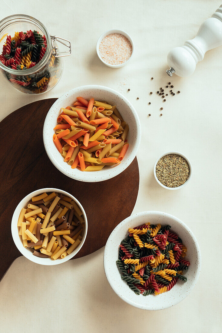 Top view of different macaroni in bowls