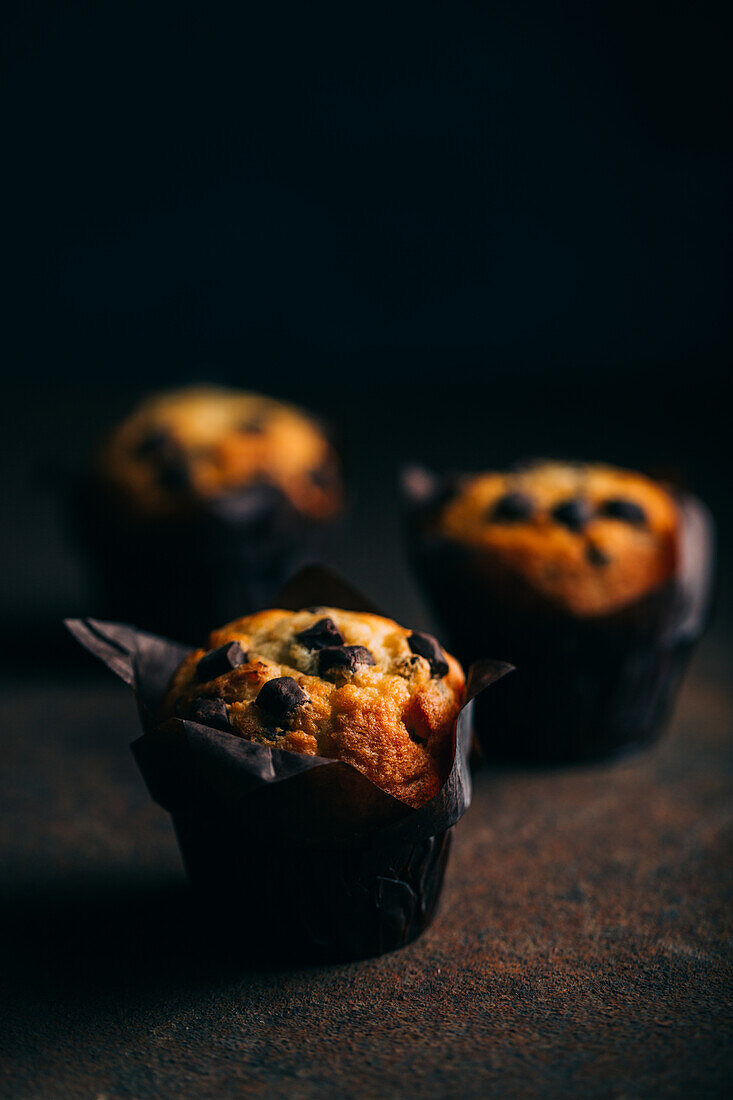 Chocolate muffins on dark background