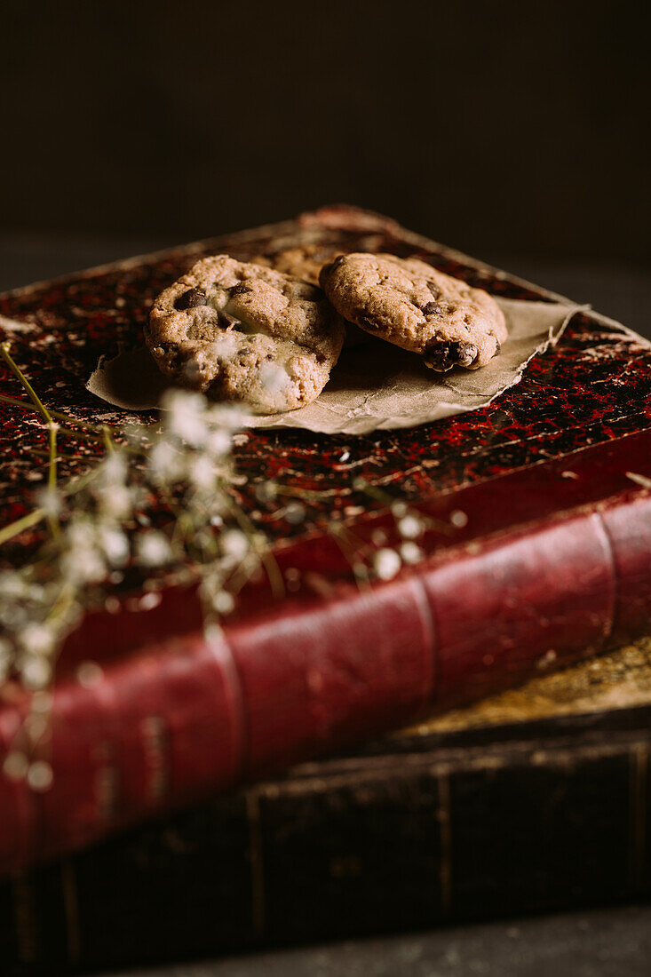 Homemade chocolate chips cookies on a old vintage book