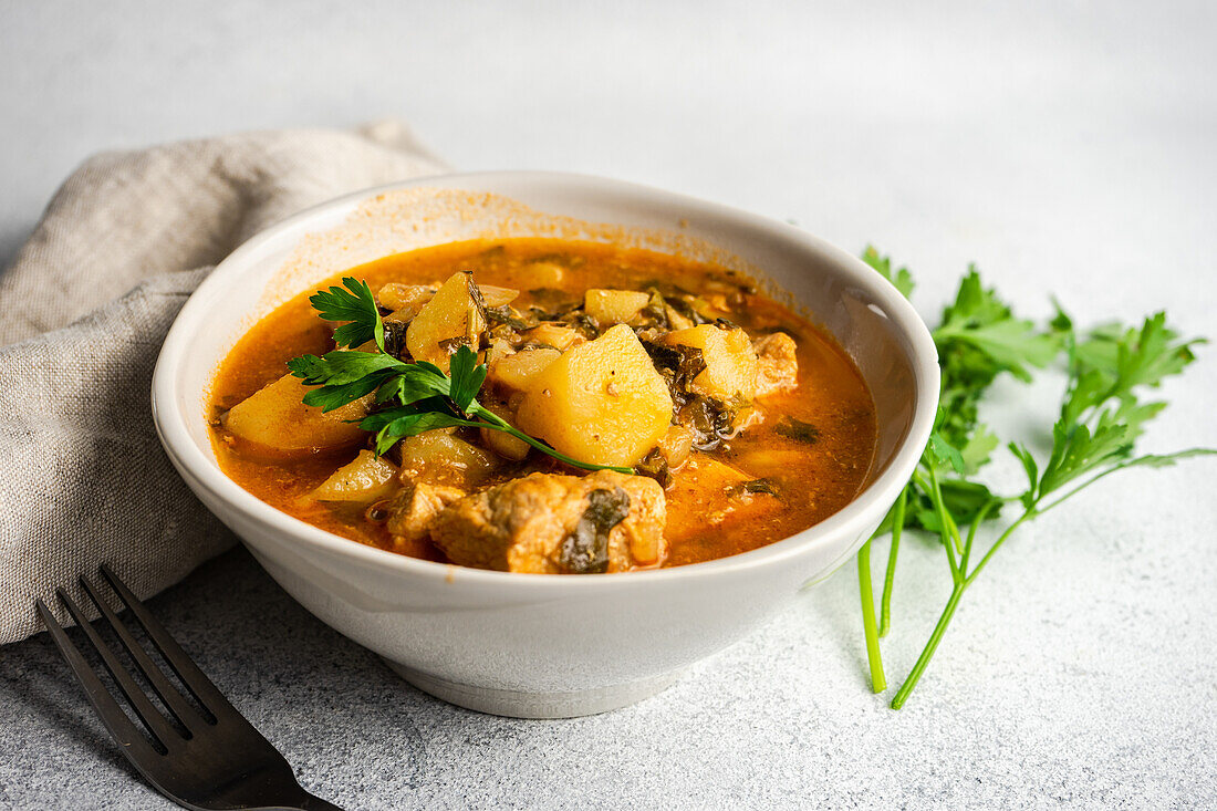 From above stewed pork meat with potato, wellknown georgian Souzi dish