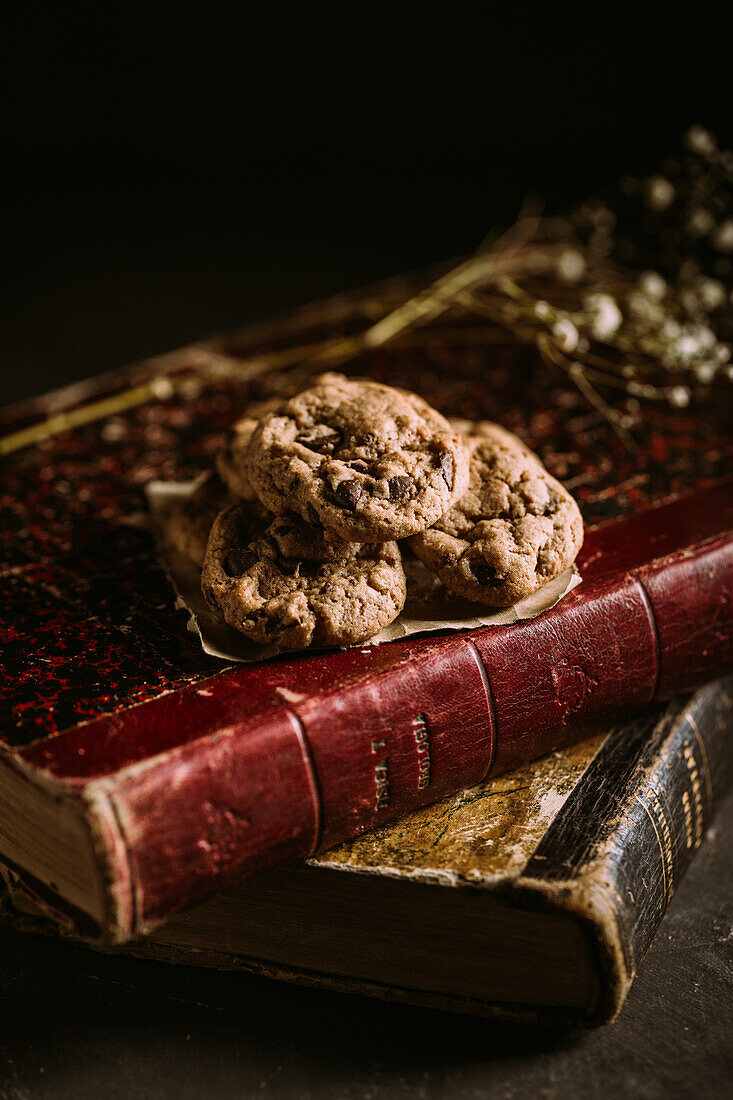 Homemade chocolate chips cookies on a old vintage book