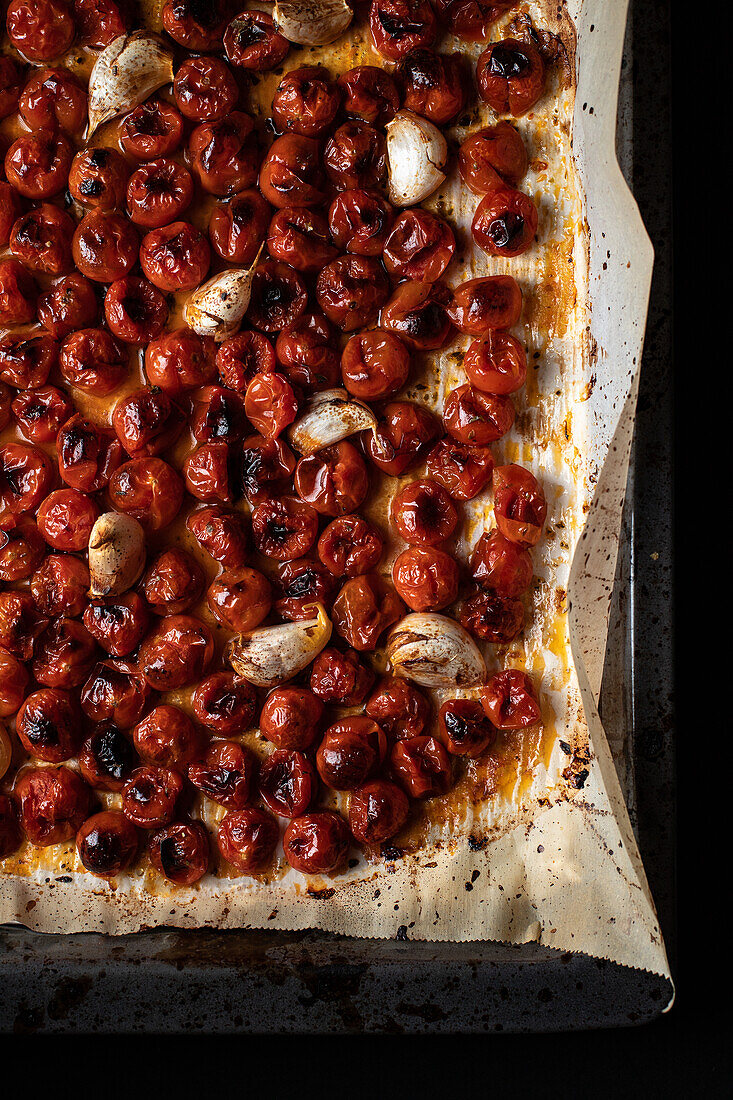 From above of full frame background of delicious casserole with roasted tomatoes and garlic