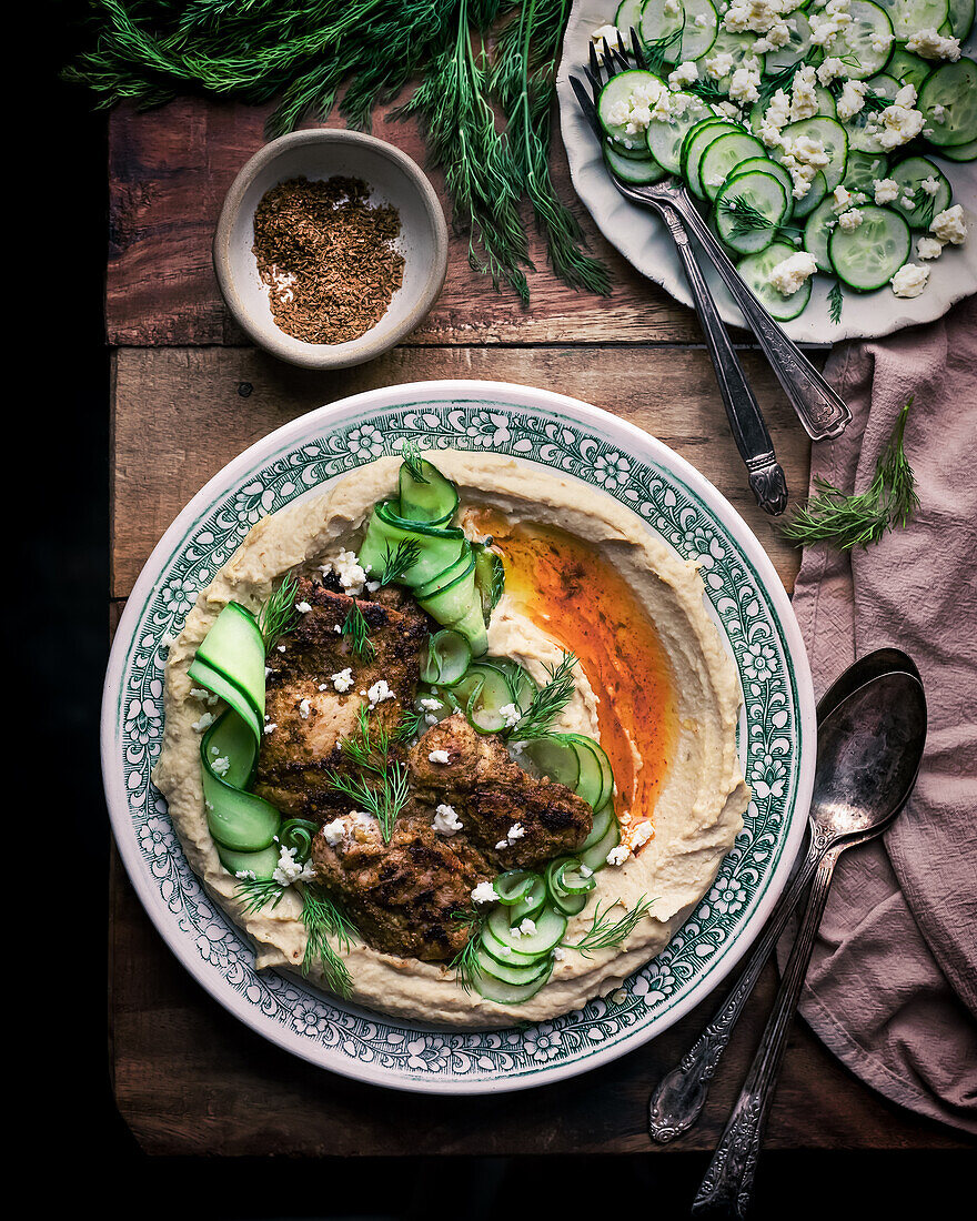 Chicken with hummus and cucumber and feta salad