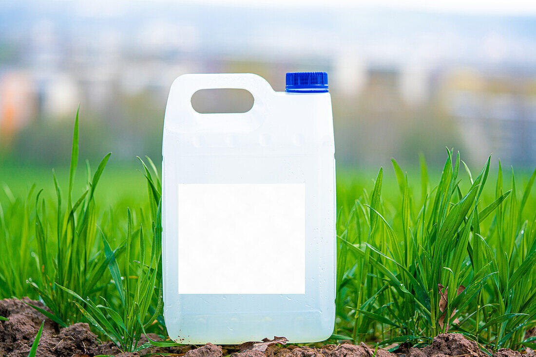 White plastic container with fertiliser