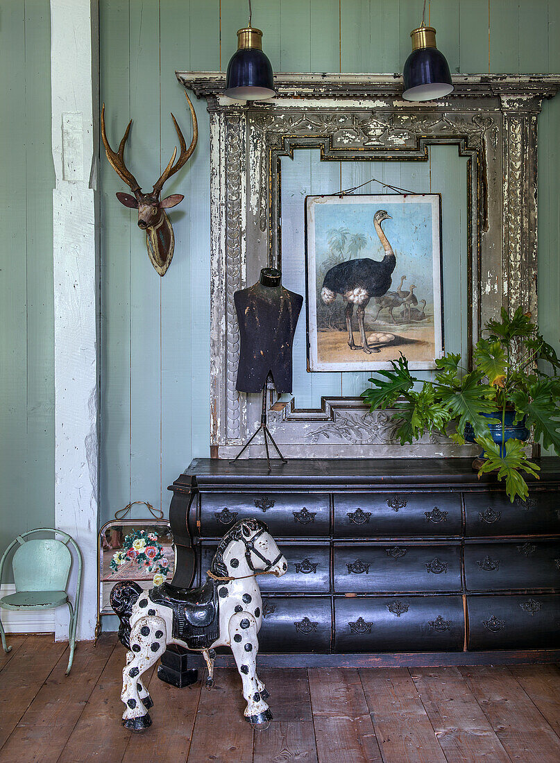 Vintage chest of drawers, antique decorations and toy horse