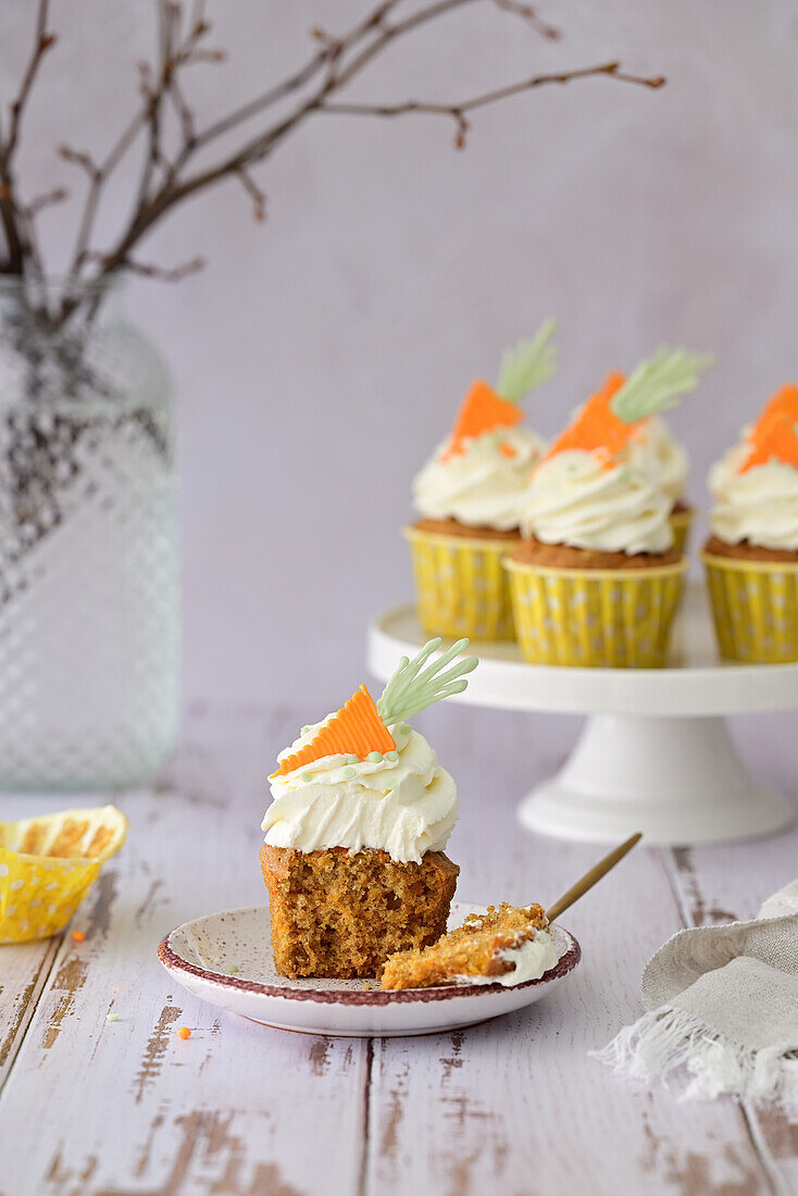 Carrot cupcakes with cream cheese filling and candied orange zest