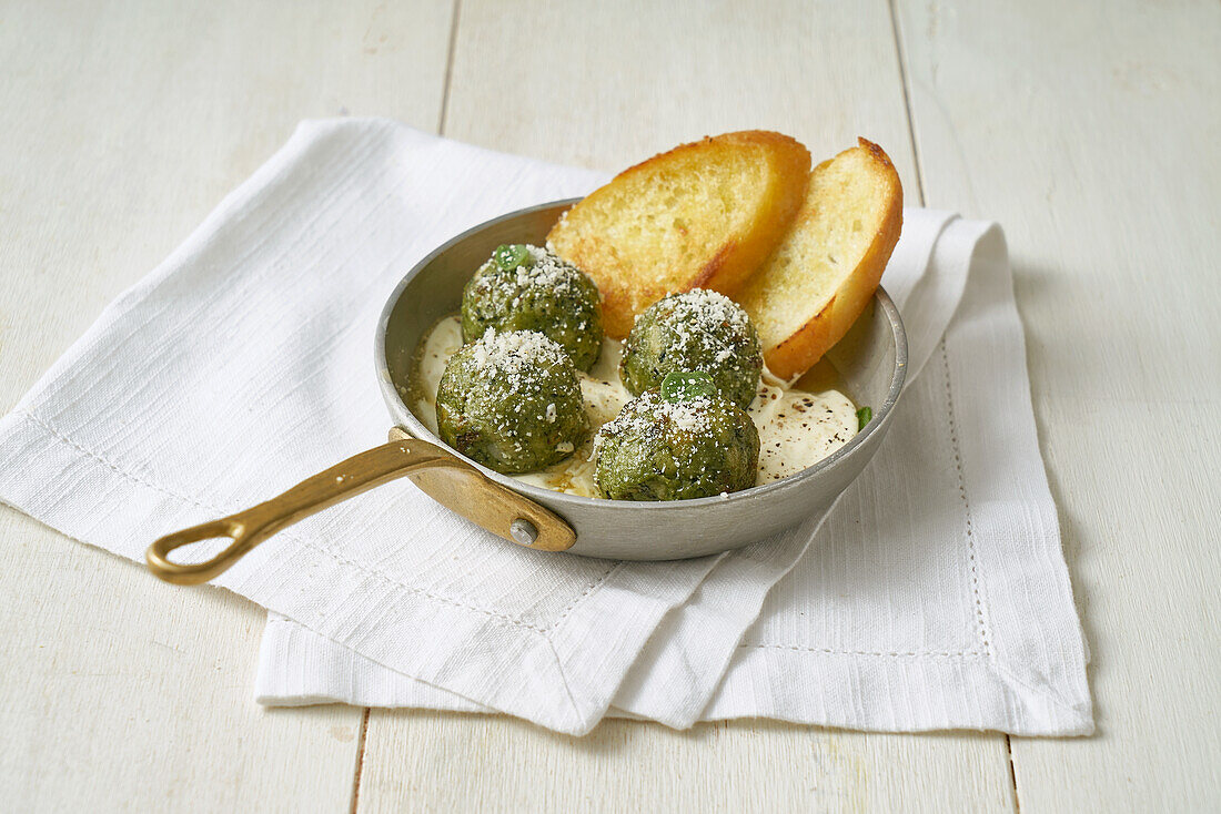 Dumplings in grana cheese fondue with crostini