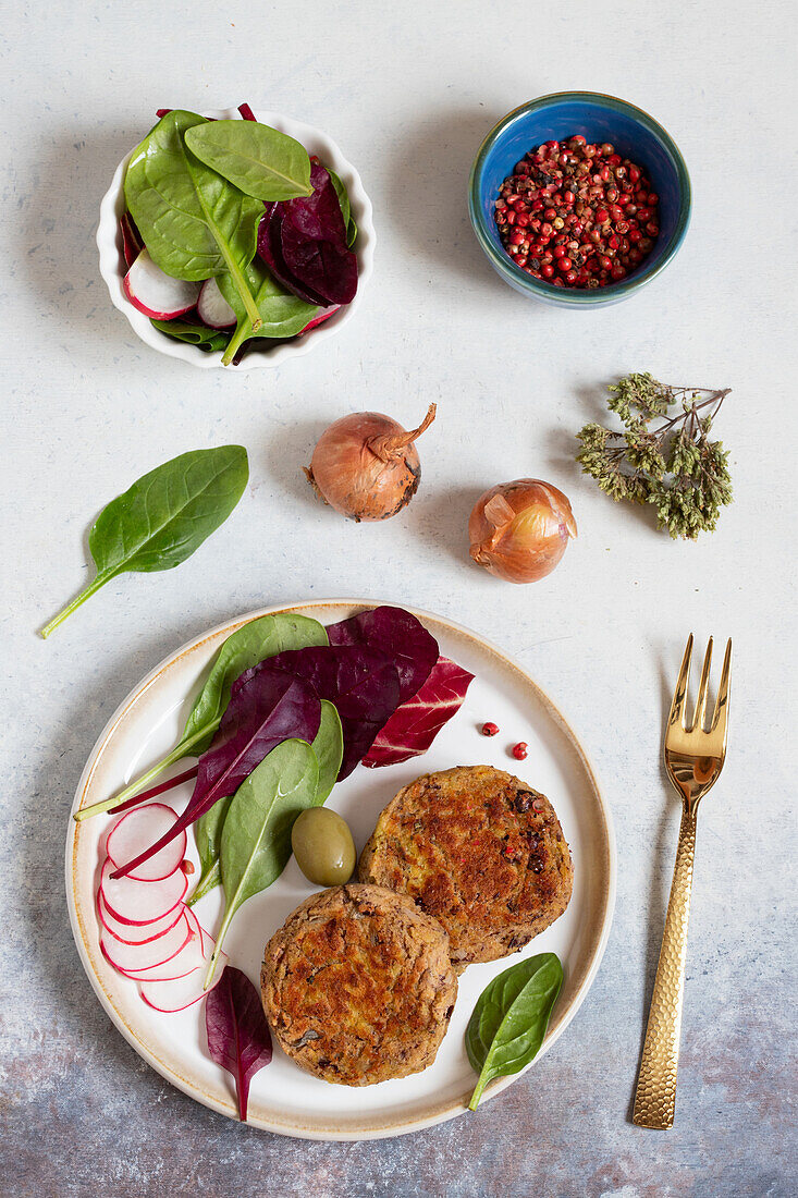 Vegan potato and kidney bean balls with leafy salads