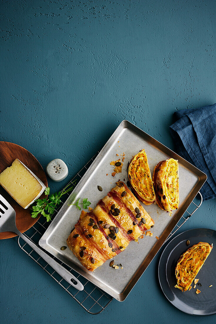 Hearty pumpkin and bacon strudel with cheese