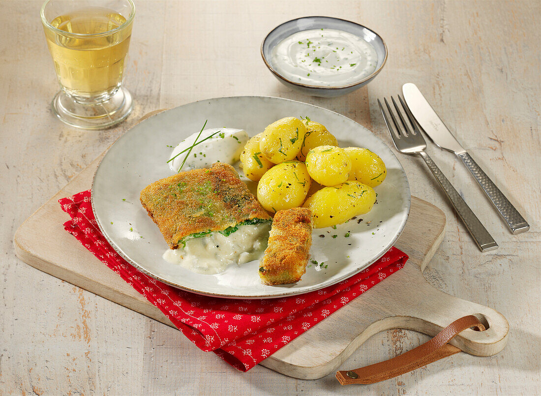 Savoy cabbage and blue cheese schnitzel with potatoes and herb quark