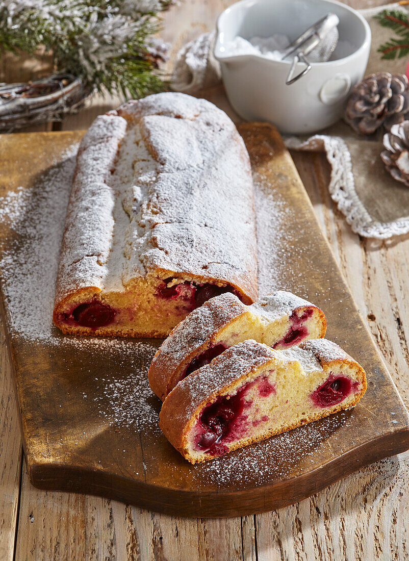 Black Forest stollen with cherries and icing sugar