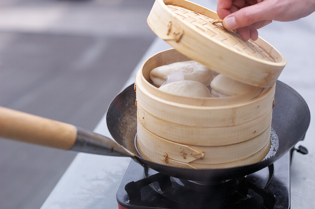 Guabao bread in a steamer basket