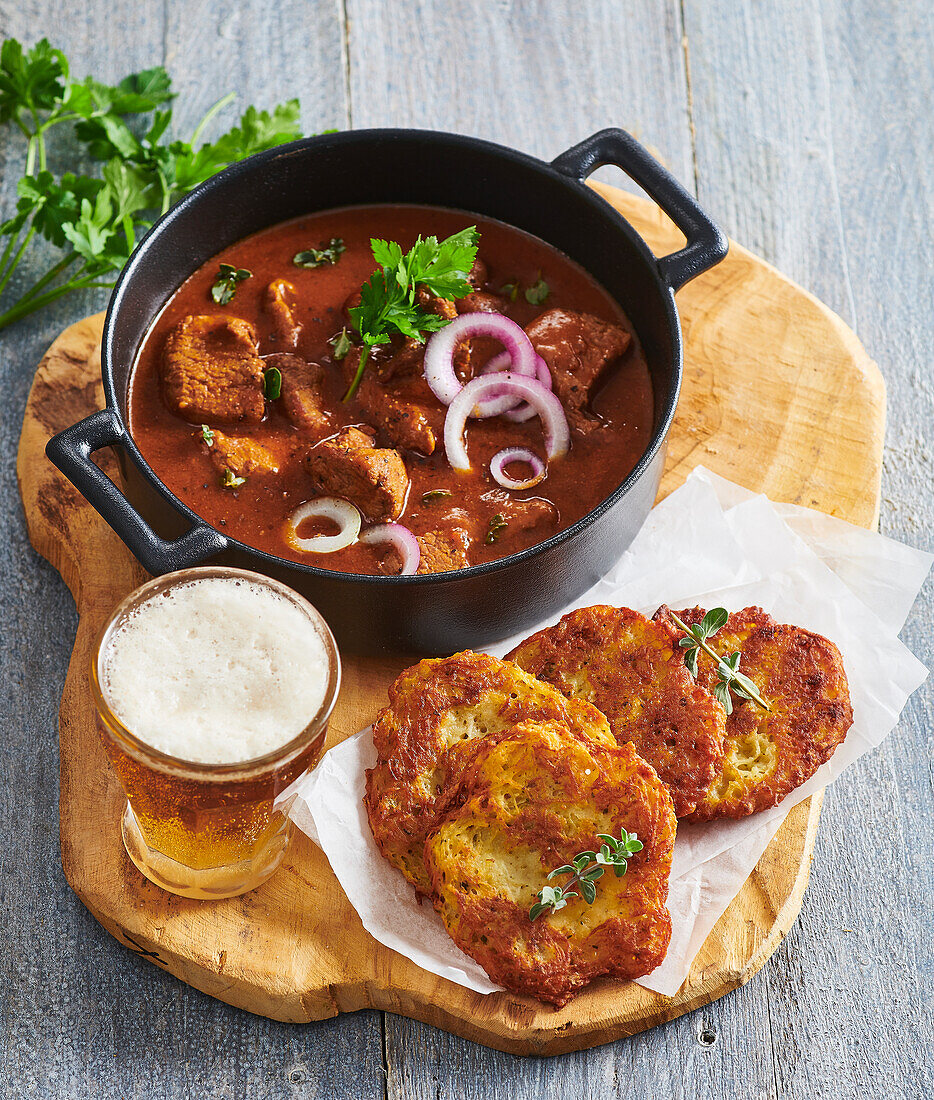 Beer goulash with pork and potato pancakes