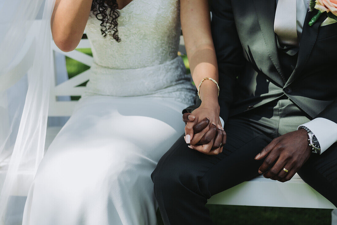 Bride and groom holding hands