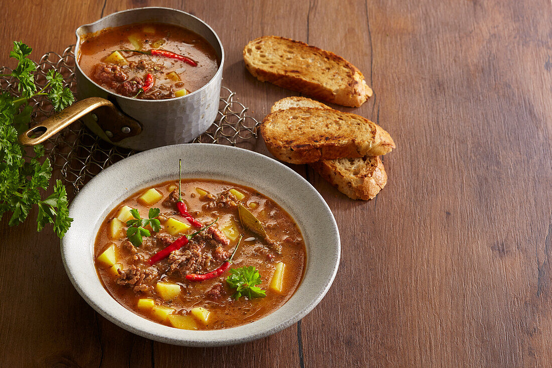 Beef goulash soup with potatoes and chilli