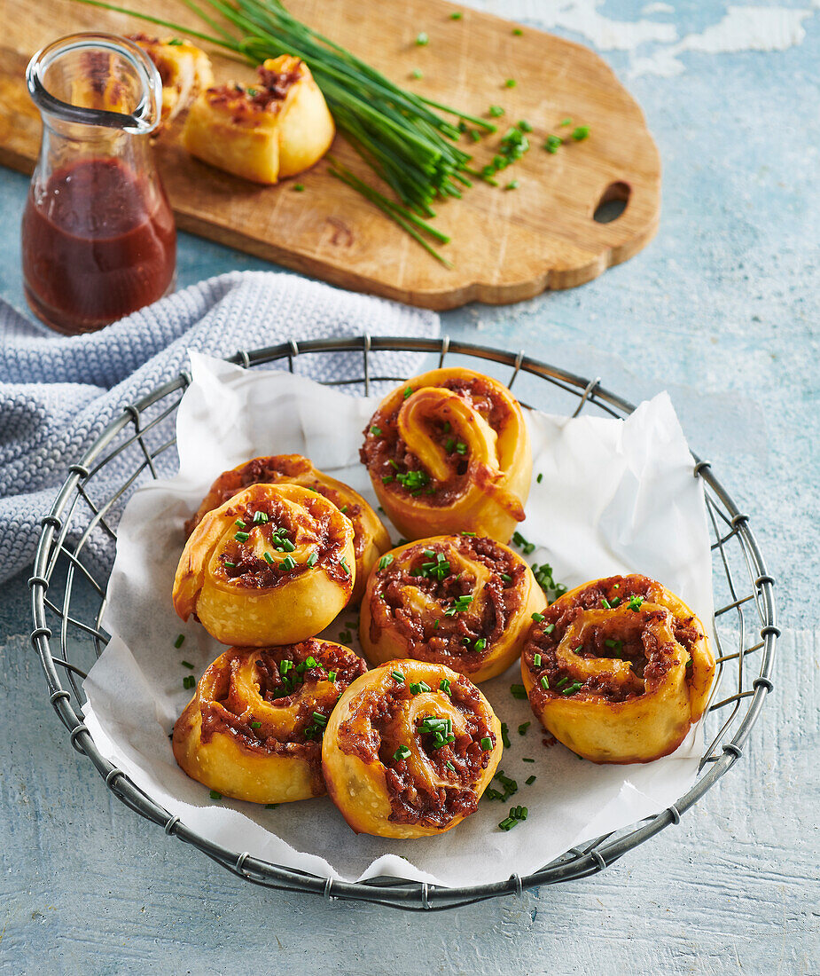Piquant pork rolls with BBQ sauce and herbs