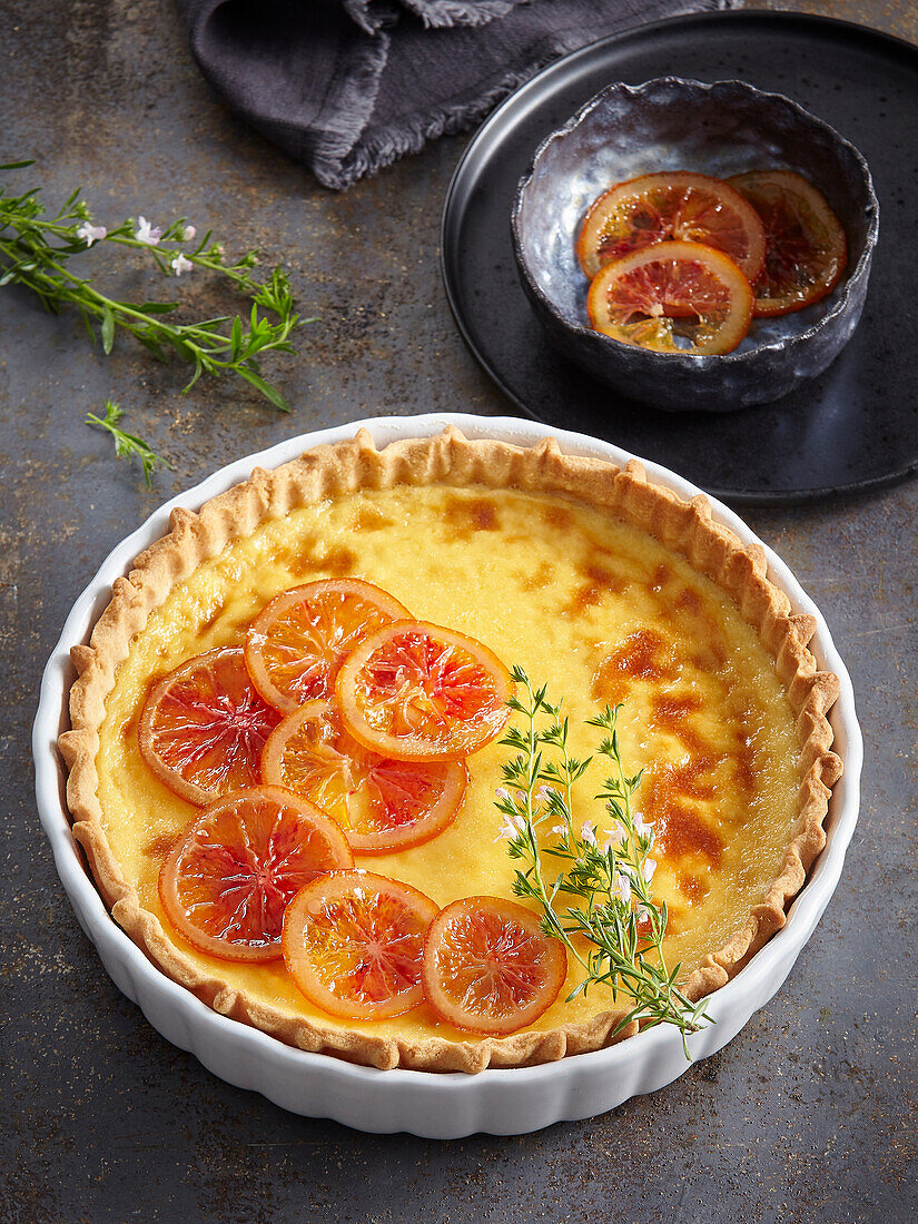 Crème brûlée tart with caramelised orange slices