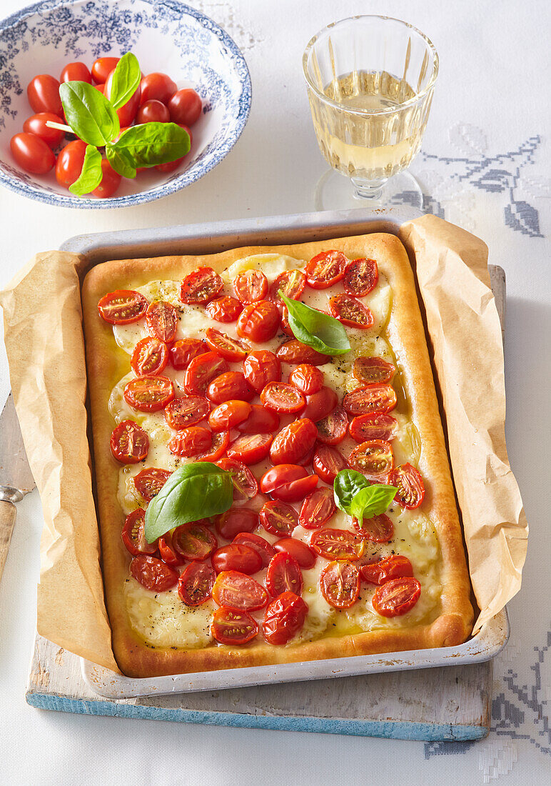 Focaccia with cherry tomatoes, mozzarella and basil