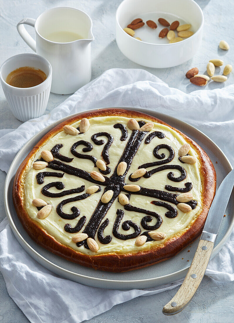 Yeast cake with quark filling, plum jam and almonds