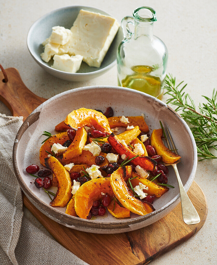 Baked pumpkin with honey, cranberries and feta