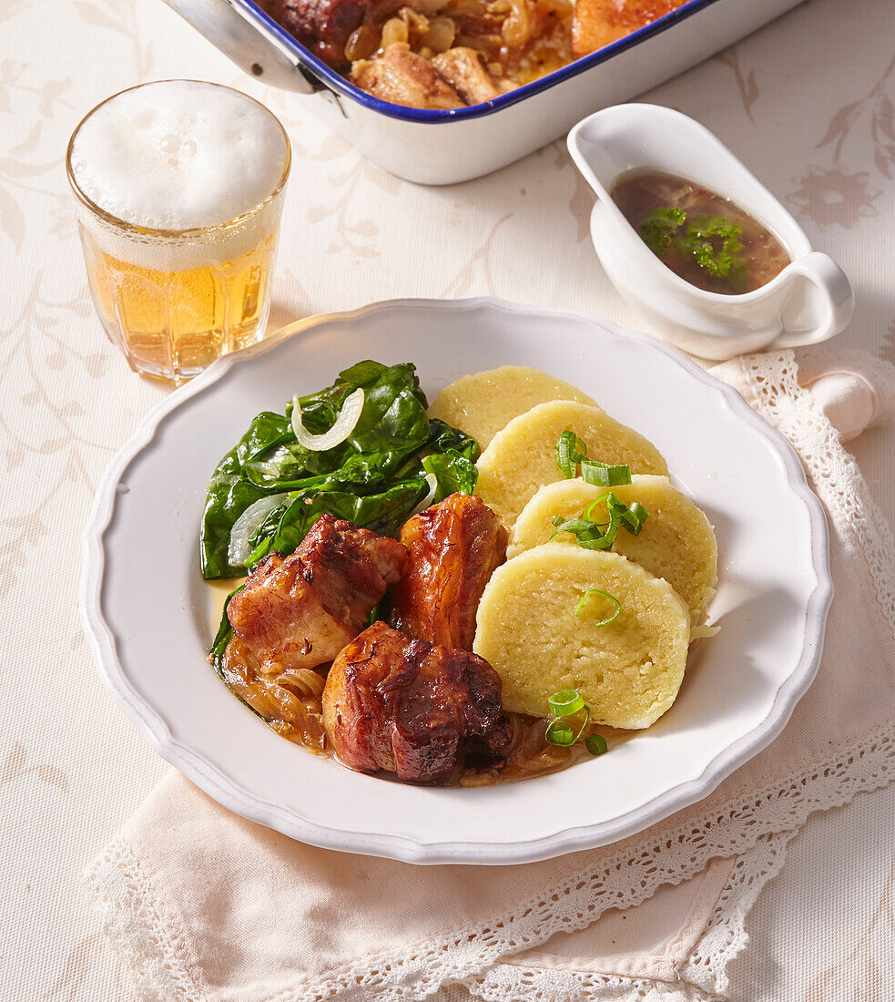 Roast pork with spinach and Bohemian dumplings