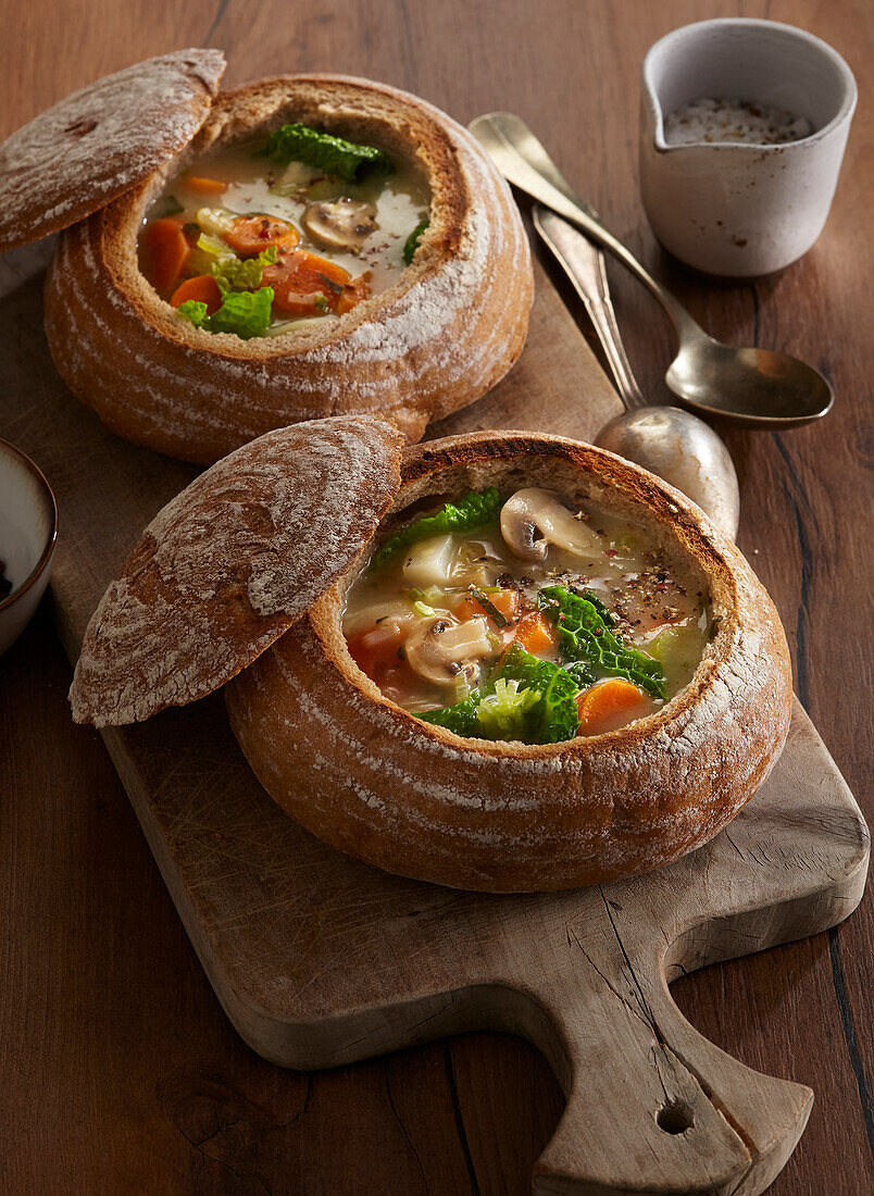 Vegetable soup in a hollowed-out loaf of bread