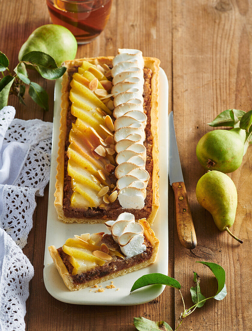 Walnut tart with pears, meringue and blackberries
