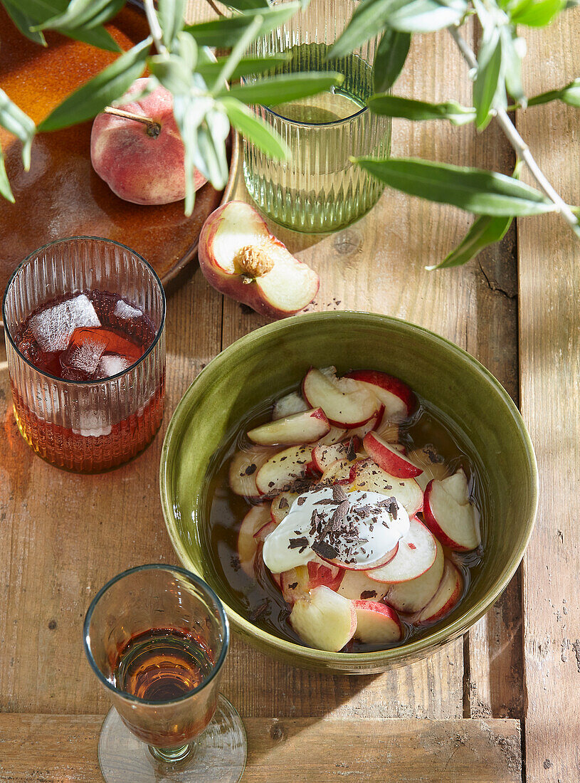 Marinated peaches with cream and chocolate shavings