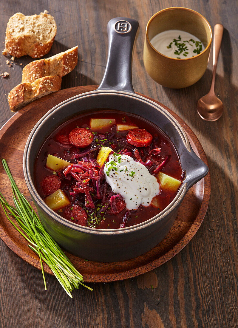 Beetroot soup with sausage and sour cream
