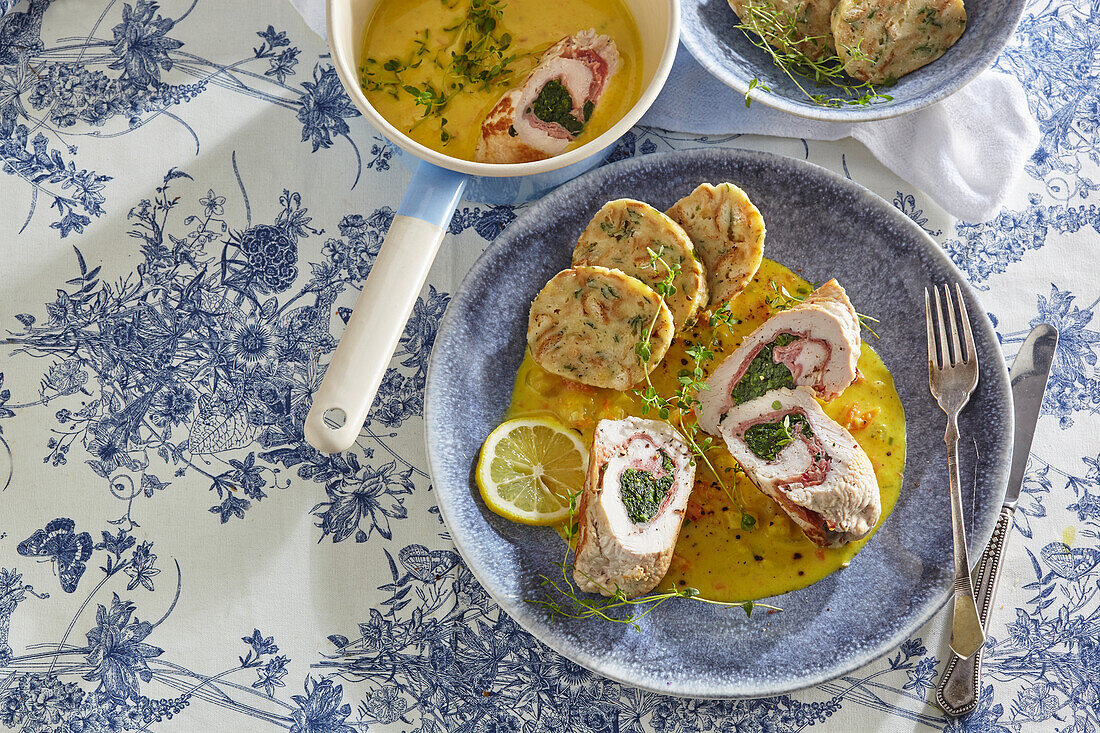 Turkey roulades with ham in a vegetable cream sauce